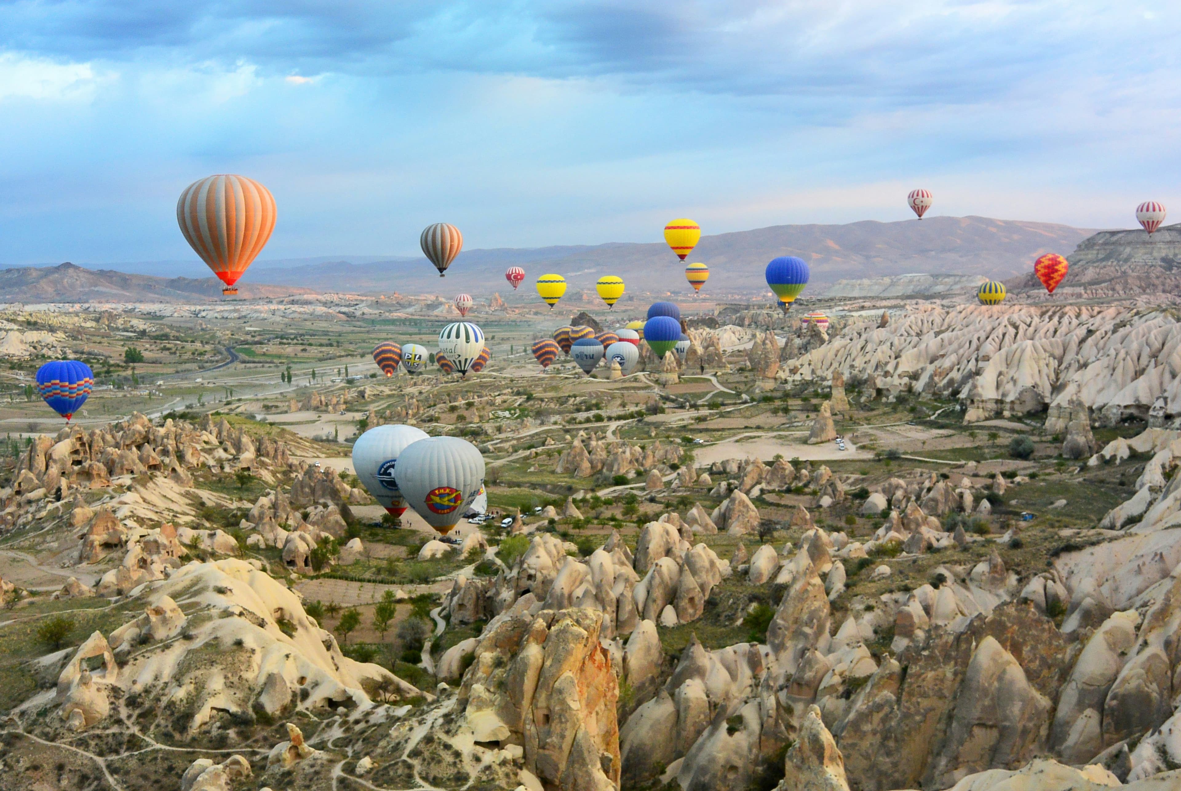 hero · balloons over göreme, dawn, first light on fairy chimneys
